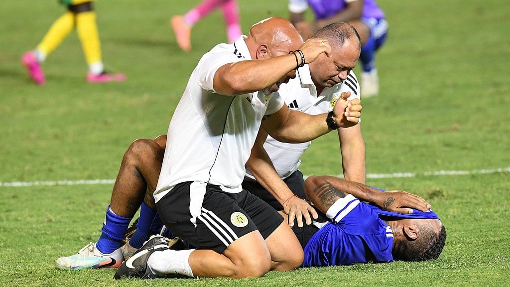 AP : Curacao players and trainers celebrate qualifying for the 2026 FIFA World Cup after their game with Jamaica in Kingston.
