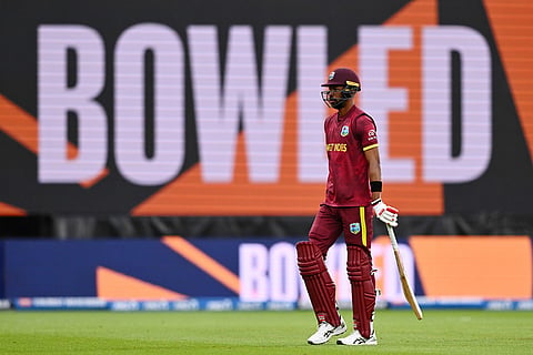 West Indies' Roston Chase walks off after he is bowled by New Zealand's Nathan Smith during their One Day International cricket match in Napier, New Zealand.