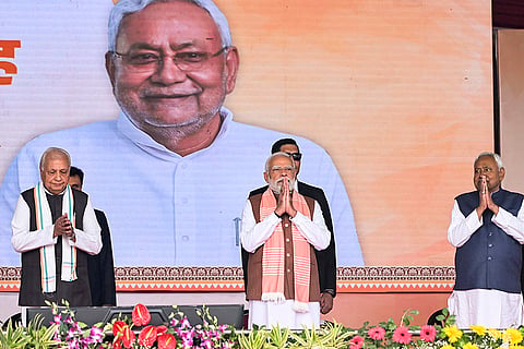 Prime Minister Narendra Modi, Bihar Governor Arif Mohammad Khan and JD(U) supremo Nitish Kumar during the swearing-in ceremony of NDA government, at Gandhi Maidan in Patna.