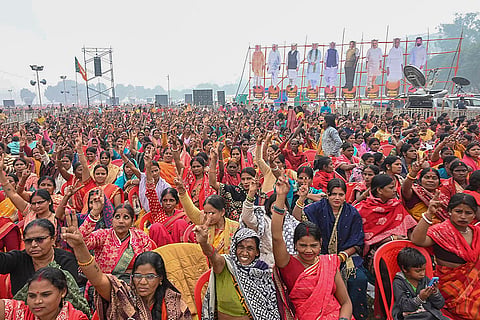 People gather at Gandhi Maidan to attend the swearing-in ceremony of NDA government, in Patna, Bihar.