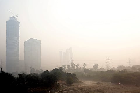A thick blanket of smog covers an area as air quality deteriorates, in New Delhi.