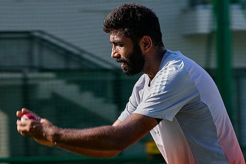 India's Jasprit Bumrah bowls at net during a practice session ahead of the second test match between India and South Africa in Guwahati.