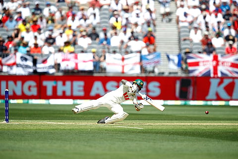 Australia's Jake Weatherald loses his balance as he gets out lbw during the first Ashes cricket test match between Australia and England in Perth.