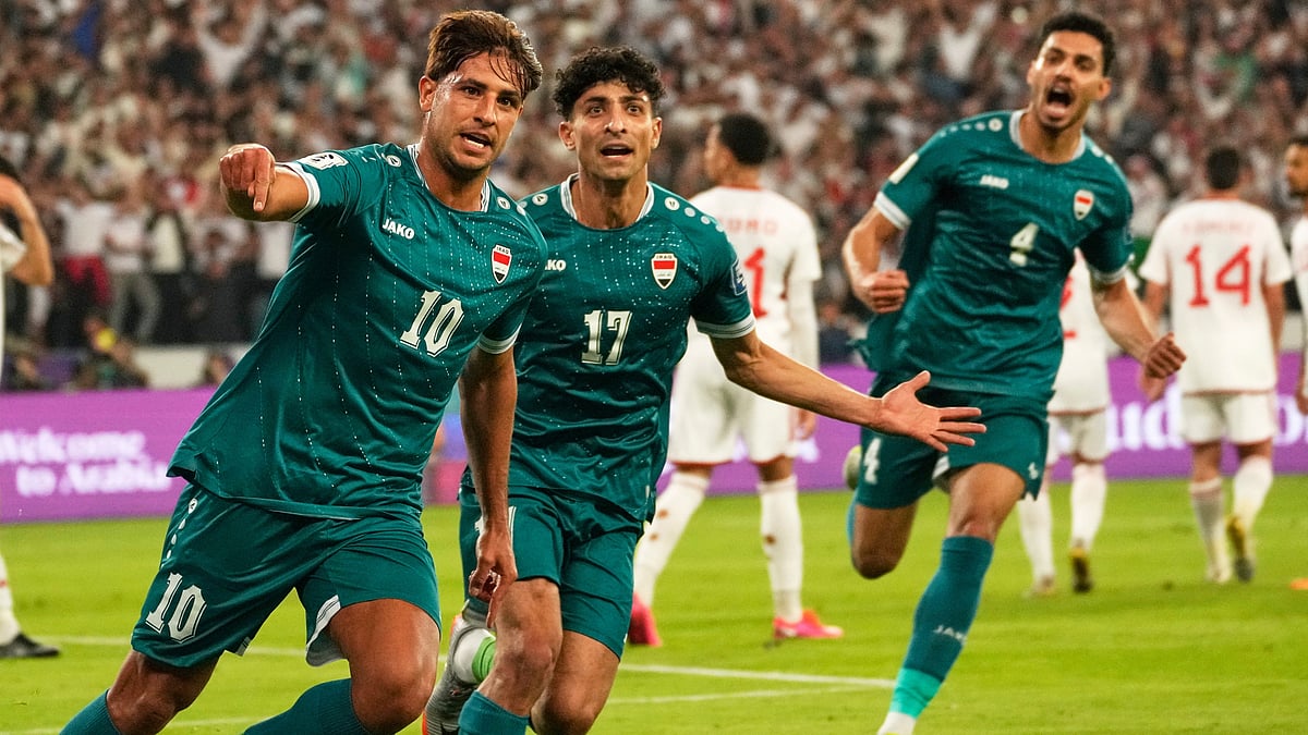 | Photo: AP/Hadi Mizban : Iraqi's Mohanad Ali celebrates with teammates after scoring his side's first goal during the 2026 World Cup play off second leg match between Iraq and UAE, in Basra on Tuesday, November 18, 2025. 