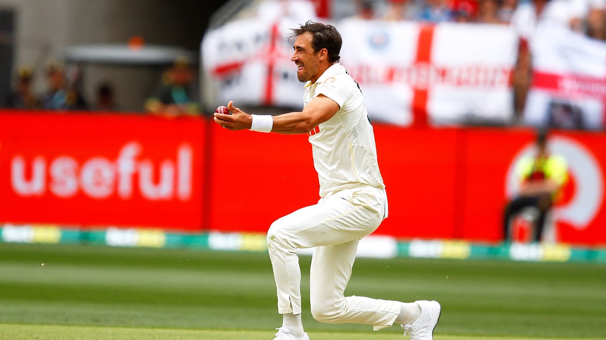 (AP Photo/Gary Day) : Australia's Mitchell Starc celebrates the wicket of England's Zak Crawley on day two of the first Ashes cricket test match between Australia and England in Perth, Saturday, Nov. 22, 2025.