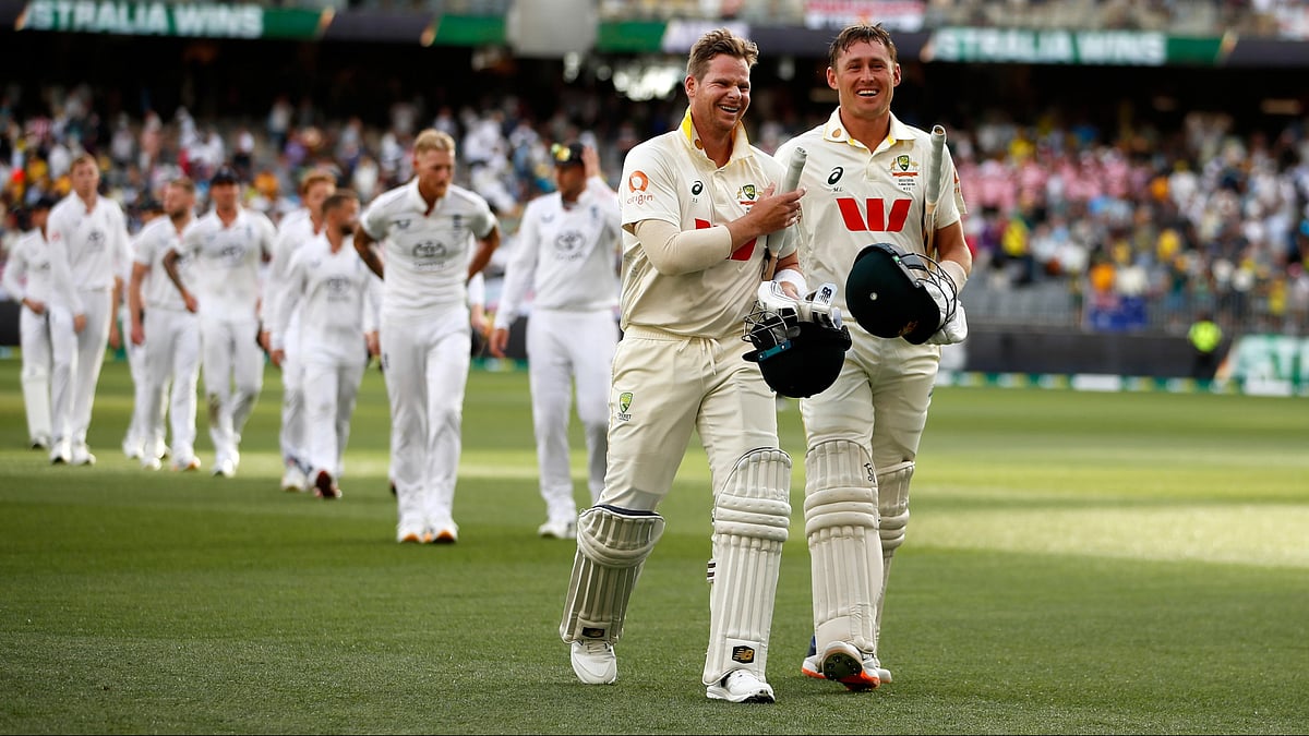 (AP Photo/Gary Day) : Australia's captain Steve Smith, left, and Marnus Labuschagne leave the field after winning their first Ashes cricket test match against England in Perth, Saturday, Nov. 22, 2025