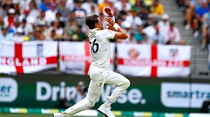 (AP Photo/Gary Day) : Australia's Mitchell Starc bowls a delivery on day two of the first Ashes cricket test match between Australia and England in Perth, Saturday, Nov. 22, 2025.