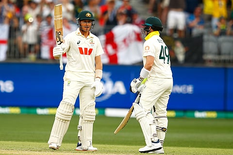Australia's Marnus Labuschagne, left, celebrates his fifty runs on day two of the first Ashes cricket test match between Australia and England in Perth.