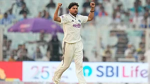 | Photo: AP/Aijaz Rahi : India's Kuldeep Yadav celebrates the dismissal of South Africa's Marco Jansen on the second day of the first cricket test match between India and South Africa in Kolkata.