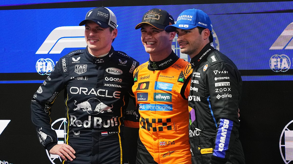 AP/Eric Gay : From left, second place finisher Red Bull driver Max Verstappen of the Netherlands, first place finisher McLaren driver Lando Norris of Great Britain, and third place finisher Williams driver Carlos Sainz of Spain pose for a photo after a qualifying session
