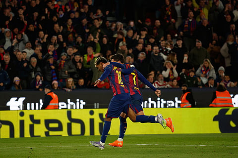 Barcelona's Lamine Yamal, left, and Ferran Torres celebrate after scoring during a La Liga soccer match between Barcelona and Athletic in Barcelona, Spain.