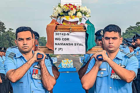 In this image, Mortal remains of Wing Commander Namansh Syal, who lost his life in the LCA Tejas crash during the Dubai Air Show on Friday, brought to the Sulur Air Base for last rites, in Coimbatore.