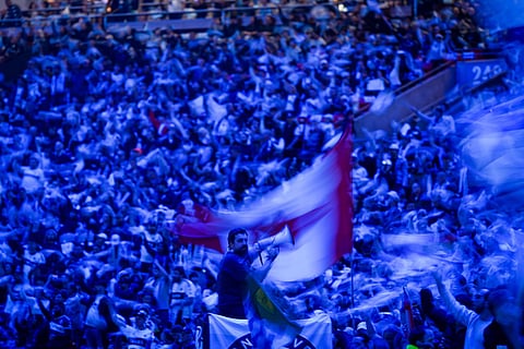 Fans wave flags and towels before the Vancouver Whitecaps and Los Angeles FC play in the MLS Western Conference semifinal soccer match in Vancouver, British Columbia.