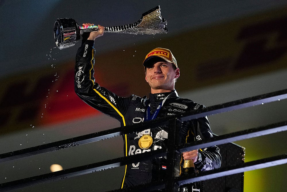 | Photo: AP/John Locher : First place finisher Red Bull driver Max Verstappen of the Netherlands celebrates after the Formula One Las Vegas Grand Prix auto race in Las Vegas.