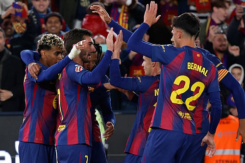 Barcelona p;ayers celebrate after a goal during a La Liga soccer match between Barcelona and Athletic in Barcelona, Spain.