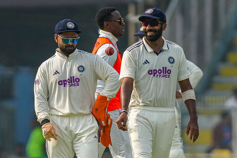 Indias captain Rishabh Pant with Jasprit Bumrah