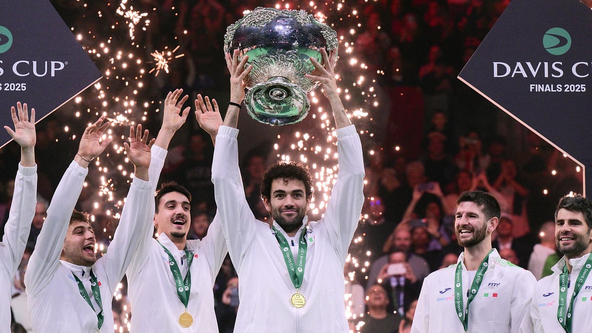 Opta : Italy player Matteo Berrettini lifting the Davis Cup 2025 trophy after defeating Spain in the finals.