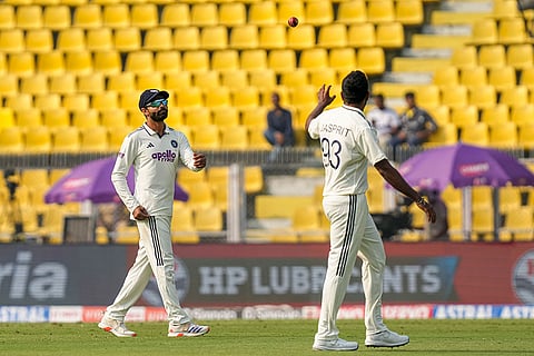 India's Jasprit Bumrah with teammate during the day two of the second Test cricket match of a series between India and South Africa, at ACA Stadium in Guwahati.