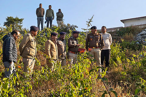 Police along with bomb disposal squad and canine units comb the area after the recovery of gelatin sticks near Government High Secondary School in Dabra village, Almora, Uttarakhand.