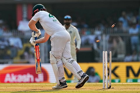 South Africa's Simon Harmer bowled out by India's Jasprit Bumrah on the second day of the second cricket test match between India and South Africa in Guwahati.