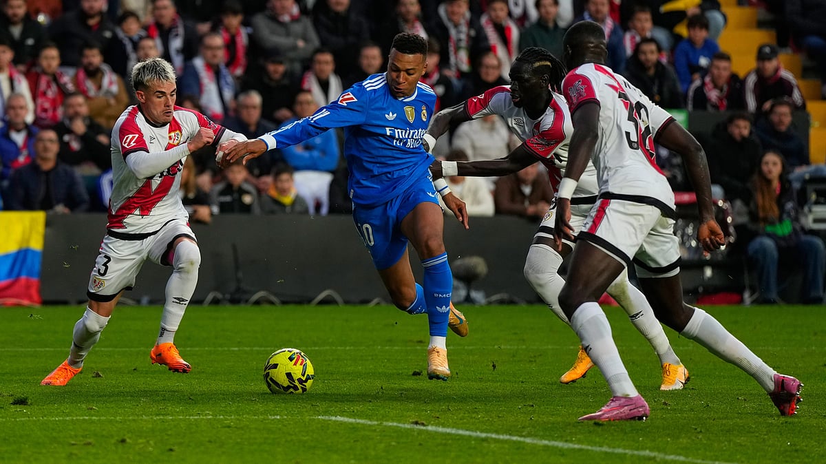 | Photo: AP/Manu Fernandez : Rayo Vallecano's Pep Chavarria and teammates stop Real Madrid's Kylian Mbappe from scoring during a Spanish La Liga match on November 9, 2025.