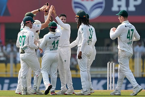 South Africa's players celebrate the dismissal of India's KL Rahul on the third day of the second cricket test match between India and South Africa in Guwahati.