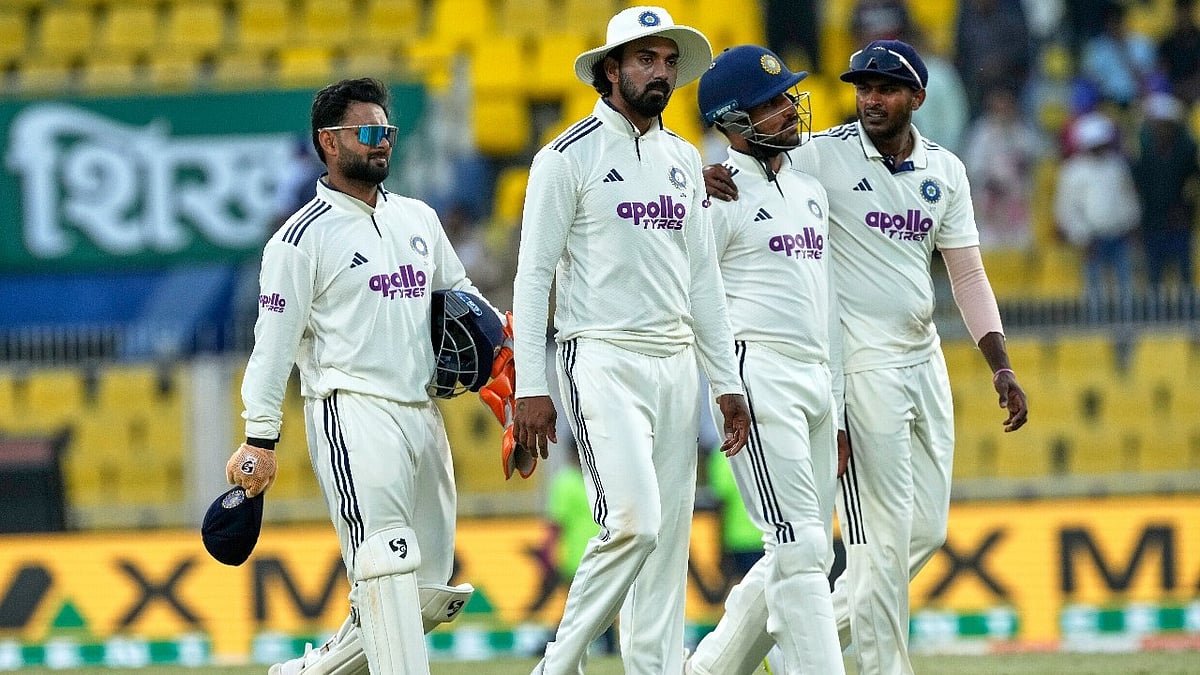 AP Photo/Anupam Nath : India's players walk off the field at the end of the third day of the second cricket test match between India and South Africa in Guwahati, India, Saturday, Nov. 22, 2025.
