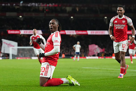 Arsenal's Eberechi Eze celebrates after scoring during a Premier League soccer match between Arsenal and Tottenham in London.