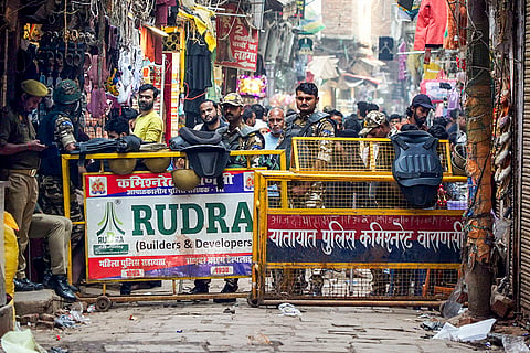 Security personnel deployed during demolition of illegal buildings at Dalmandi, in Varanasi.