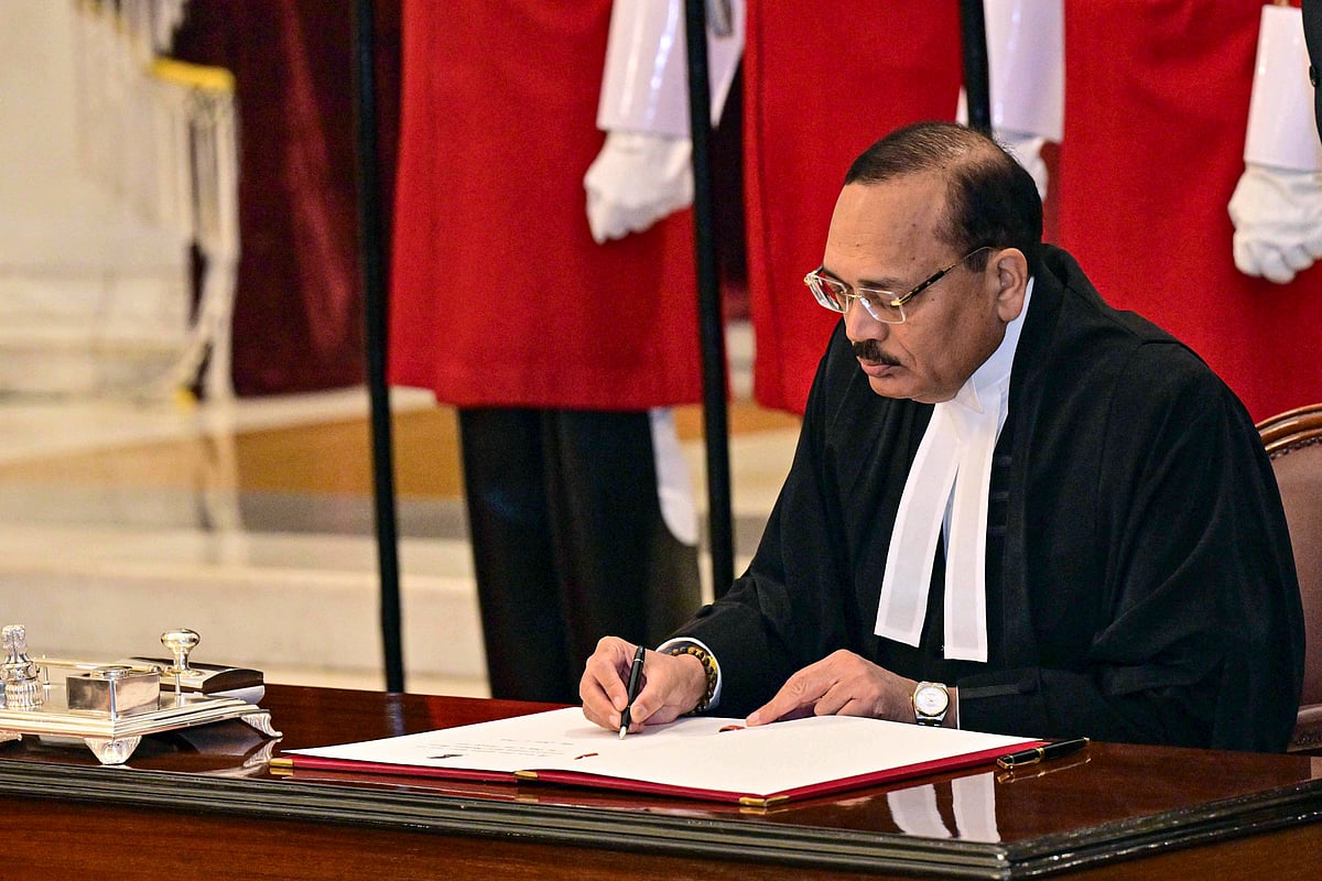 PTI : Nov. 24, 2025, Justice Surya Kant signs the documents after taking oath as the 53rd Chief Justice of India (CJI), at Rashtrapati Bhavan in New Delhi