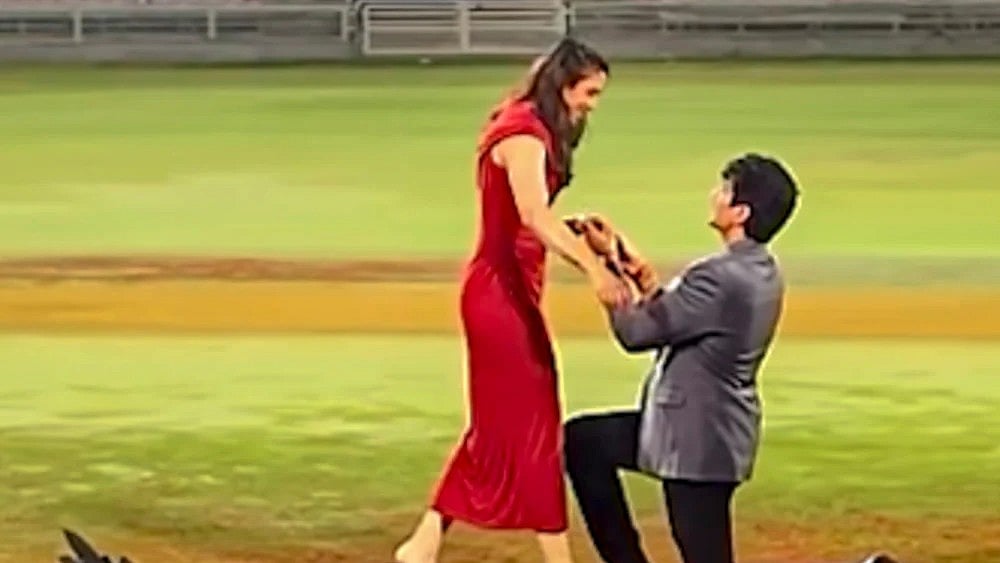 World Cup-winning Indian women's cricket team star Smriti Mandhana being proposed by music composer Palash Mucchal for marriage at the DY Patil Stadium, in Navi Mumbai.  - | Photo: @palash_muchhal/Instagram via PTI