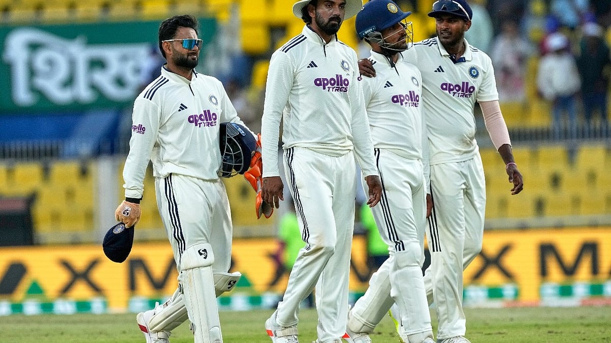 AP Photo/Anupam Nath : India's players walk off the field at the end of the third day of the second cricket test match between India and South Africa in Guwahati, India, Saturday, Nov. 22, 2025.