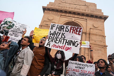 People raise slogans during a protest against worsening air quality in the national capital, at the India Gate, in New Delhi. The air quality remained in the "very poor" category on Sunday morning, with the overall Air Quality Index (AQI) recorded at 381, according to the Central Pollution Control Board (CPCB). 