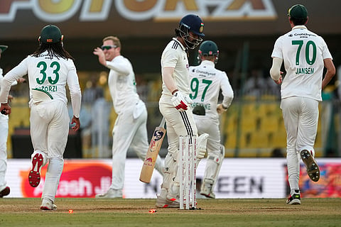 India's KL Rahul, centre, walks off the field after losing his wicket on the fourth day of the second cricket test match between India and South Africa in Guwahati.
