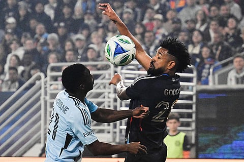 San Diego FC midfielder Anibal Godoy (20), right, fights for the ball with Minnesota United forward Bongokuhle Hlongwane (21) during the first half of MLS soccer's Western Conference semifinal in San Diego. 