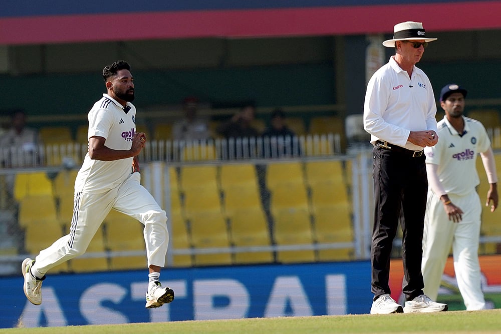 | Photo: PTI/Shahbaz Khan : India's Mohammed Siraj bowls a delivery during the fourth day of the second Test cricket match between India and South Africa, at ACA Stadium, Barsapara in Guwahati.