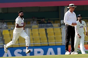 | Photo: PTI/Shahbaz Khan : India's Mohammed Siraj bowls a delivery during the fourth day of the second Test cricket match between India and South Africa, at ACA Stadium, Barsapara in Guwahati.