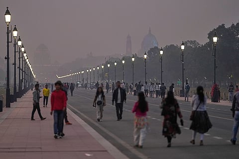Kartavya Path, the ceremonial boulevard, is seen enveloped in smog in New Delhi.