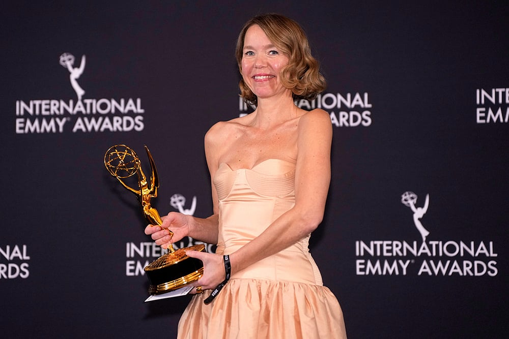 | Photo: Charles Sykes/Invision/AP : Anna Maxwell Martin, winner for Best Performance by an Actress for "Until I Kill You," appears in the press room during the 53rd International Emmy Awards at the New York Hilton Midtown in New York. 