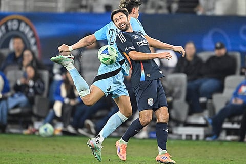 San Diego FC midfielder Luca de la Torre (14) and Minnesota United defender Nectarios Triantis (25) fight for the ball during the second half of MLS soccer's Western Conference semifinal in San Diego. 