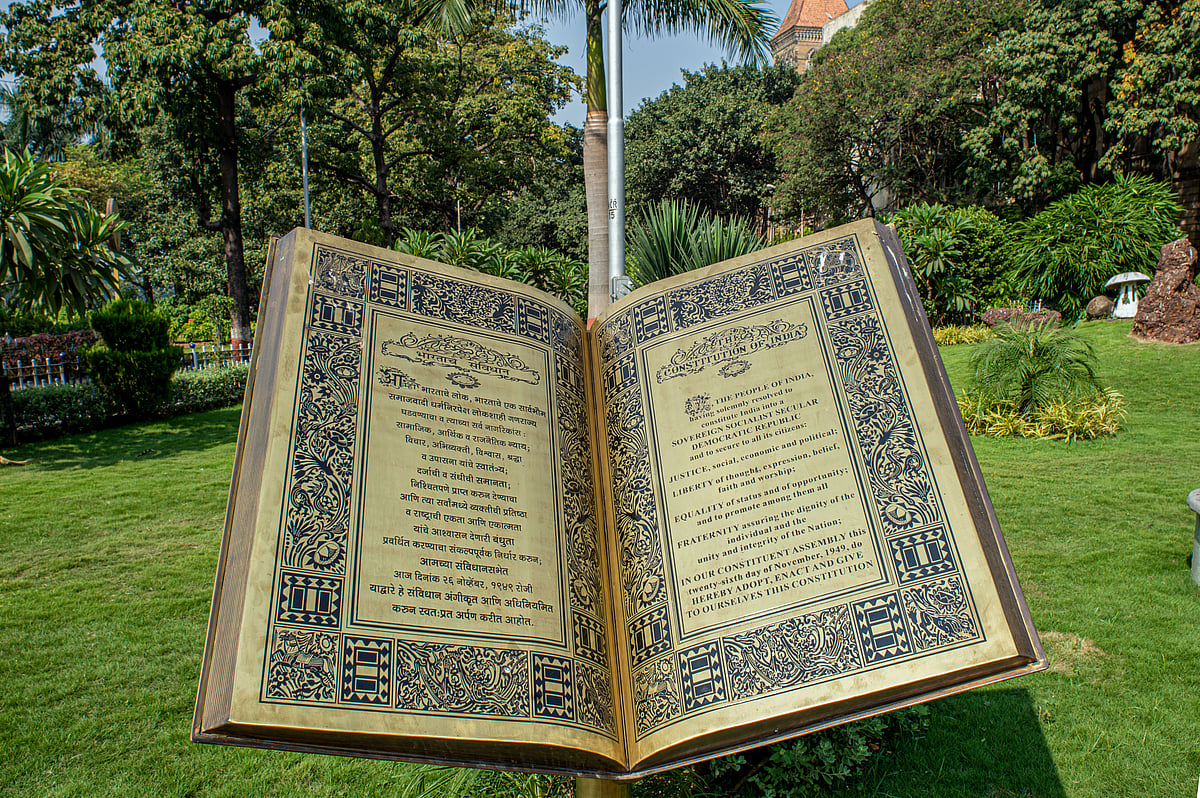 Shutterstock : 'The Constitution of India' sculpture near statue of Dr Babasaheb Ambedkar at Cooperage circle Mumbai.