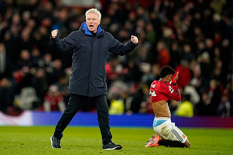 Everton's head coach David Moyes celebrates after the English Premier League soccer match between Manchester United and Everton in Manchester, England.