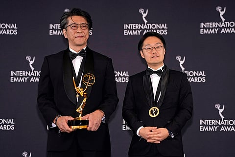Kenichi Matsumiya and Kensho Omori, right, winners in the best Arts Programming category for "Ryuichi Sakamoto: Last Days," appear in the press room during the 53rd International Emmy Awards at the New York Hilton Midtown in New York. 