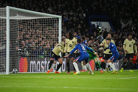 Barcelona's Jules Kounde, second left, scored an own goal during the Champions League opening phase soccer match between Chelsea and Barcelona in London.