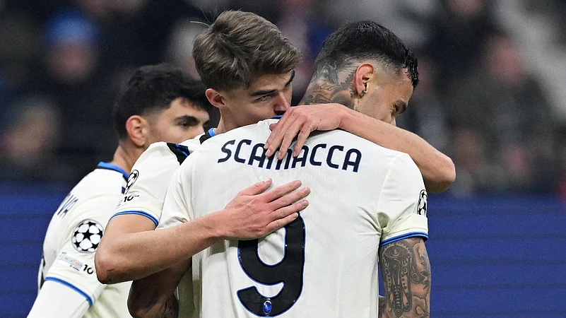 Atalanta players celebrate scoring against Frankfurt.