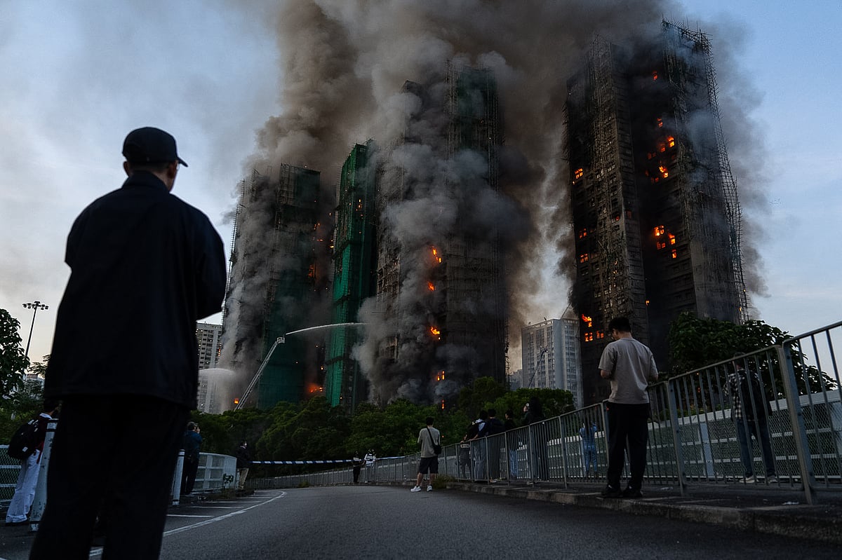 Smoke rises after a fire broke out at Wang Fuk Court, a residential estate in the Tai Po district of Hong Kong's New Territories on Wednesday, Nov. 26 2025. - AP Photo/Chan Long Hei