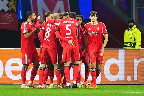 Benfica players celebrate after Benfica's Samuel Dahl scored his side's opening goal during the Champions League opening phase soccer match between Ajax and SL Benfica in Amsterdam, Netherlands.