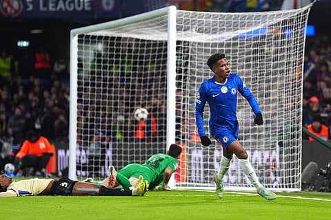 Chelsea's Estevao, right, celebrates after scoring his side's second goal during the Champions League opening phase soccer match between Chelsea and Barcelona in London, England.