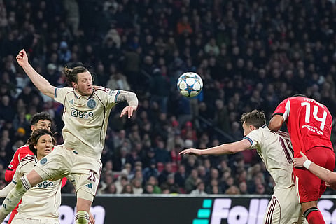 Benfica's Vangelis Pavlidis, right, in action against Ajax's Wout Weghorst during the Champions League opening phase soccer match between Ajax and SL Benfica in Amsterdam, Netherlands.