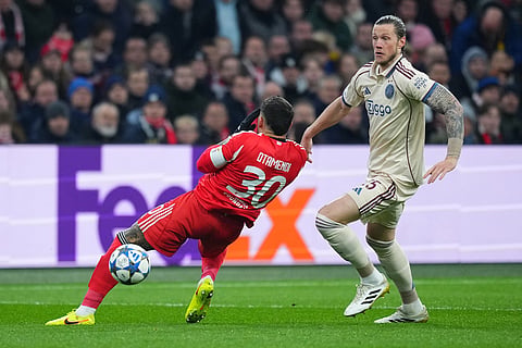 Ajax's Wout Weghorst, right, in action against Benfica's Nicolas Otamendi during the Champions League opening phase soccer match between Ajax and SL Benfica in Amsterdam, Netherlands.